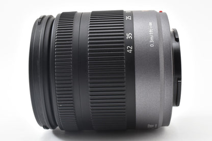 美品 Panasonic LUMIX G VARIO 14-42mm F3.5-5.6 ASPH. MEGA O.I.S H-FS014042 AFレンズ マイクロフォーサーズ フード付 260921r